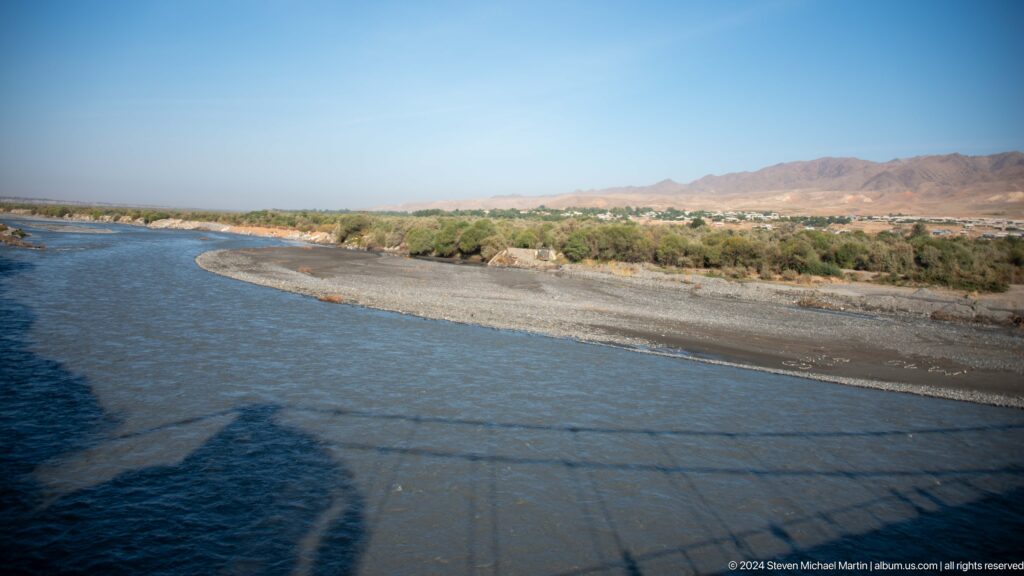 Wide river channel with gravel bars.