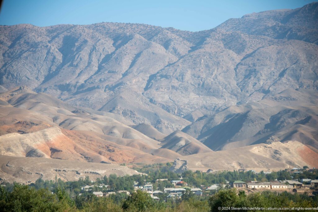 Panjakent settlement at the foot of layered mountains.