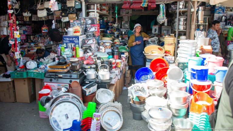 Shopfront overflowing with cookware and plastic wares.
