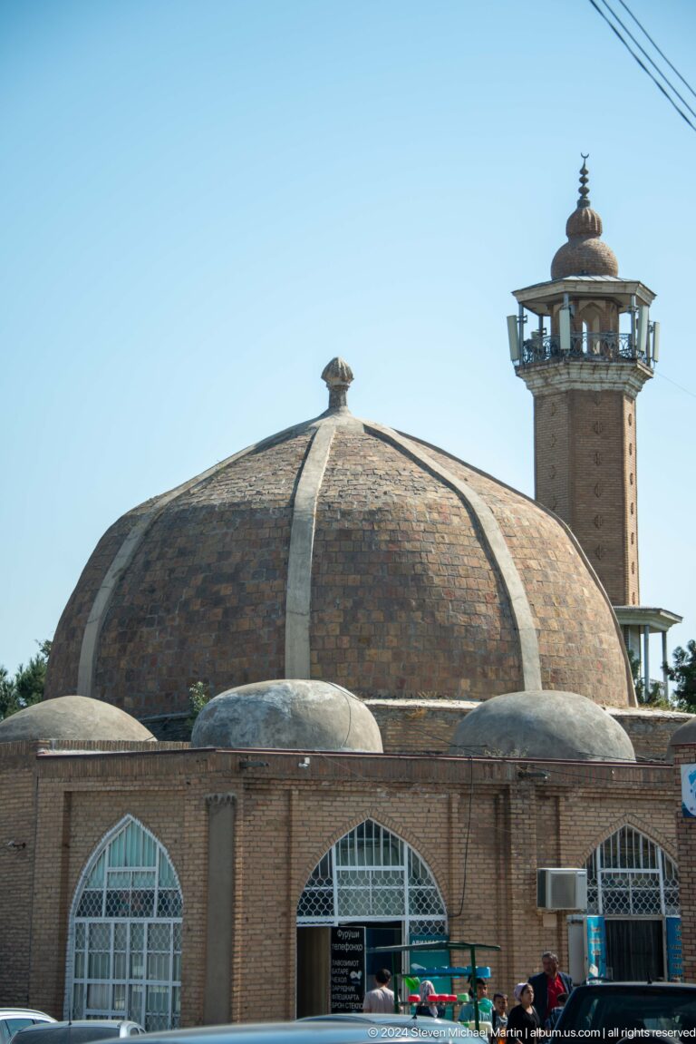 Large domed religious building with a slender minaret.