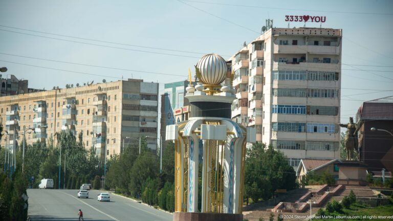 Decorative crown-like monument on a city avenue.