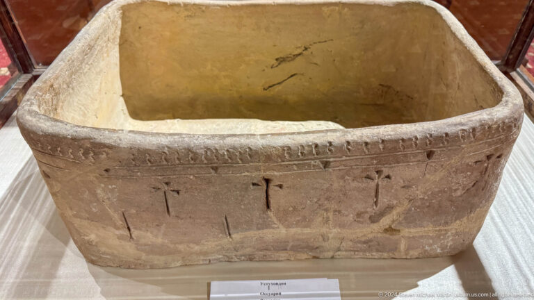 Large rectangular ceramic basin with thick walls, worn rim, and incised exterior marks.