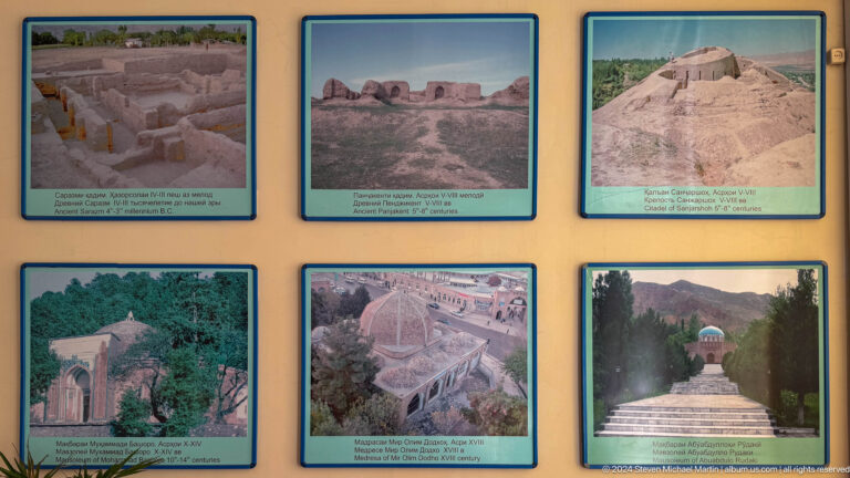 Six framed photographs of archaeological ruins and arid landscapes arranged on a wall.