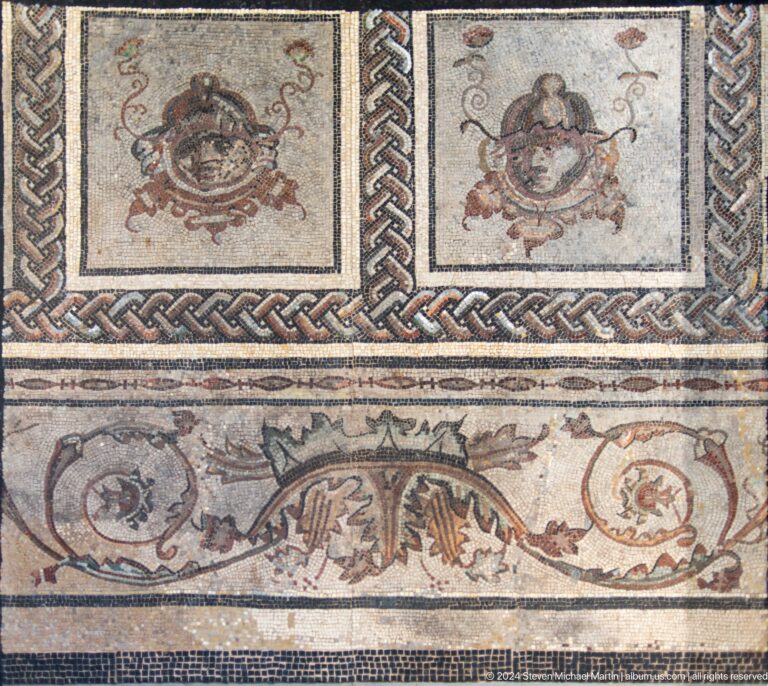 Roman mosaic with birds and marine imagery at Louvre Abu Dhabi.