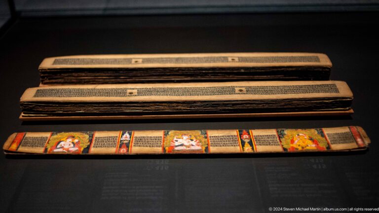 Long horizontal manuscript or painted scroll in case at Louvre Abu Dhabi.