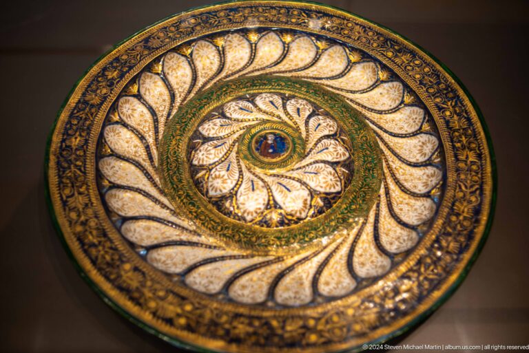 Round mosaic dish with central eye motif at Louvre Abu Dhabi.