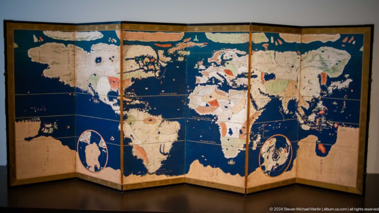 Folding screen painted with world map at Louvre Abu Dhabi.