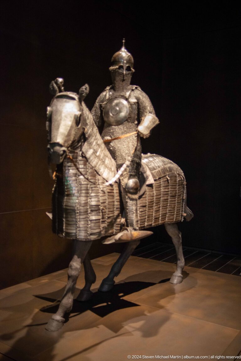 Armored rider on caparisoned horse at Louvre Abu Dhabi.