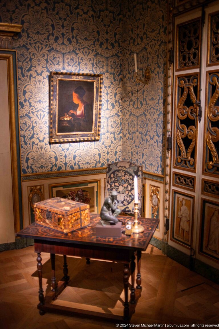 Opulent historic room with inlaid furniture at Louvre Abu Dhabi.