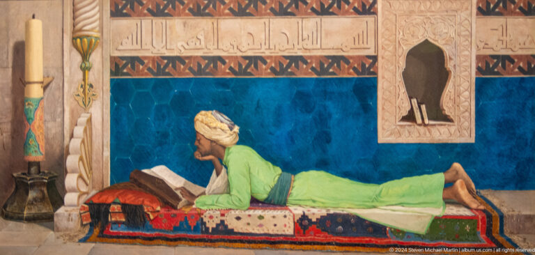 Painted reclining reader in interior at Louvre Abu Dhabi.