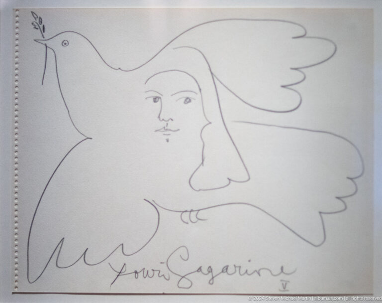 Line drawing of profile face with signature at Louvre Abu Dhabi.