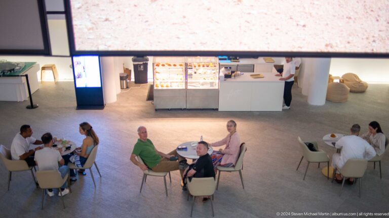 Museum café seating seen from above at Louvre Abu Dhabi.