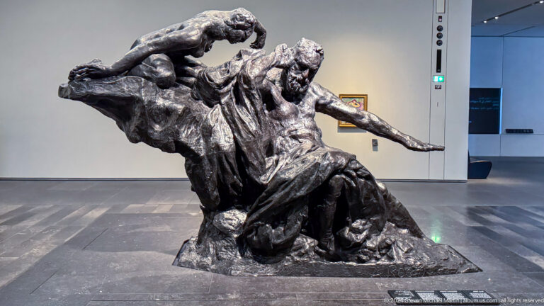 Dynamic bronze group of mounted or charging figures at Louvre Abu Dhabi.