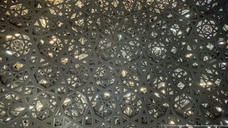 Close view of interlaced dome geometry at Louvre Abu Dhabi.