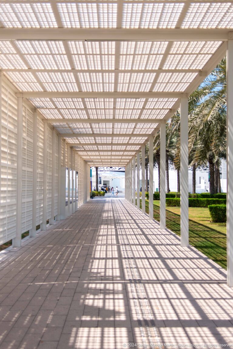 Long shaded museum approach walkway at Louvre Abu Dhabi.