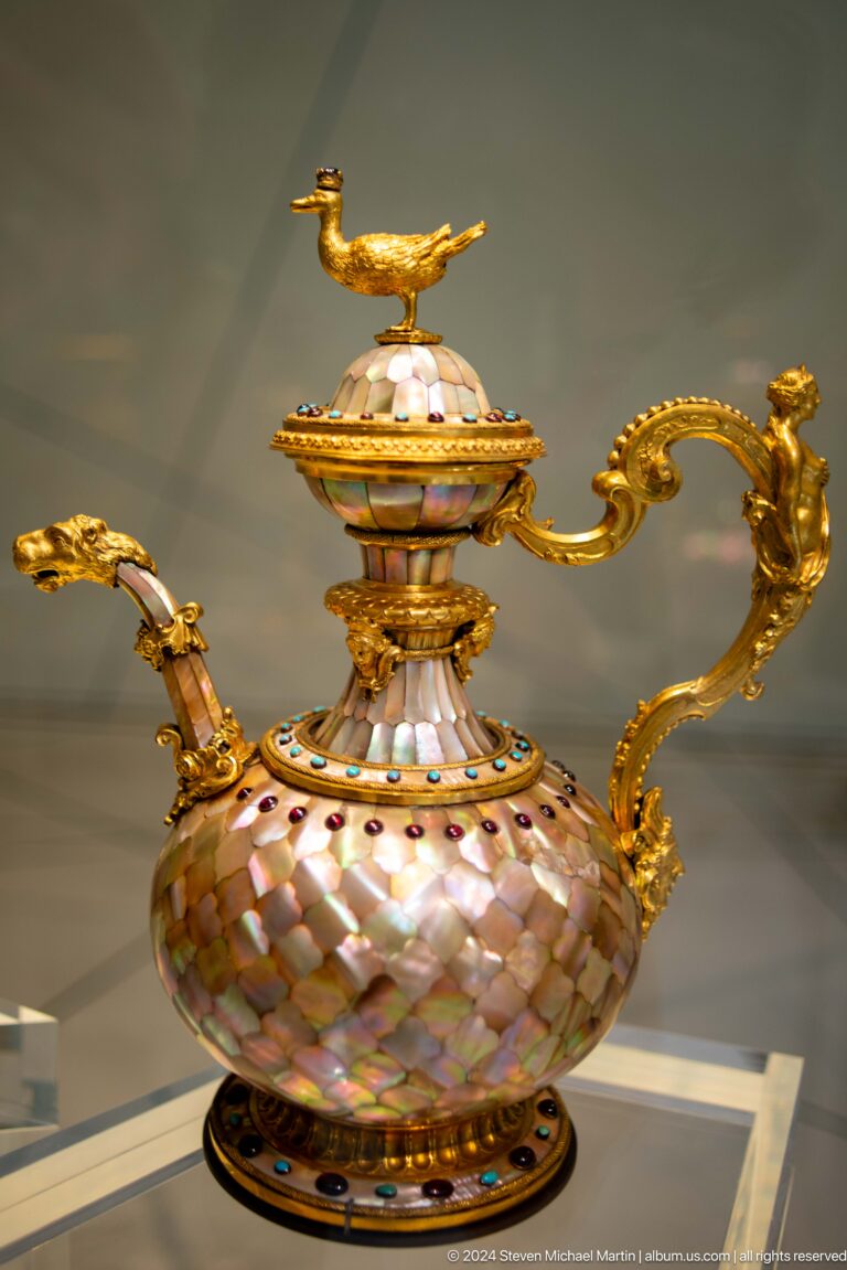 Ornate lidded vessel with gold mounts and jeweled handle at Louvre Abu Dhabi.