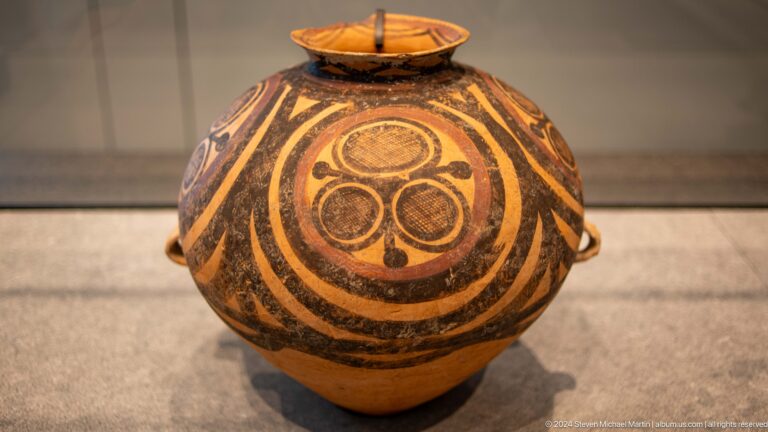 Rounded painted jar with concentric spiral decoration at Louvre Abu Dhabi.