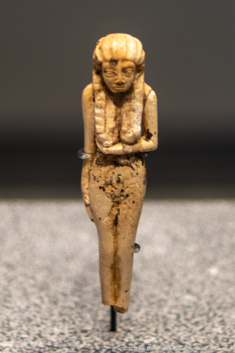 Small standing female figurine at Louvre Abu Dhabi.