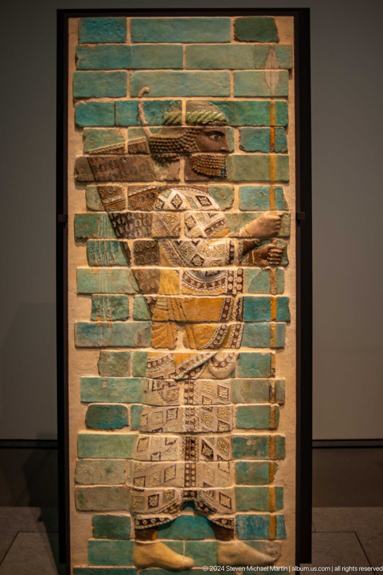 Glazed brick panel with striding lion at Louvre Abu Dhabi.