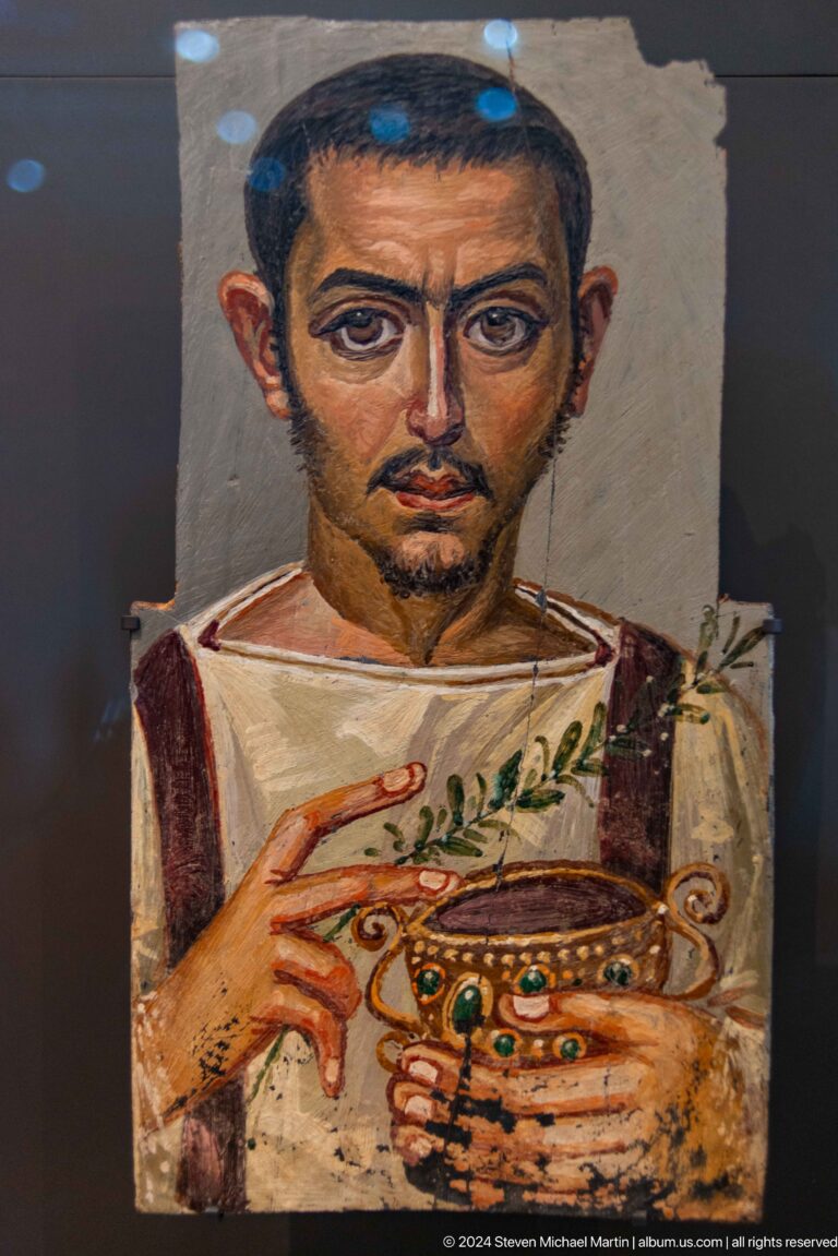Painted mummy portrait of a young man at Louvre Abu Dhabi.