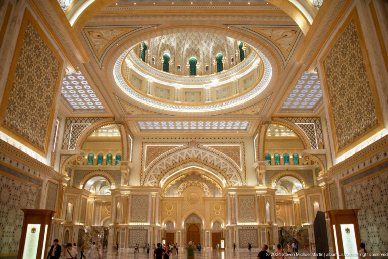 Grand hall with arches domes and polished floor.