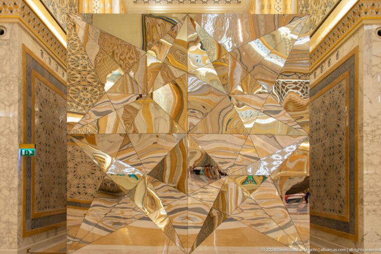 Gold sculptural installation with mirrored fragments.
