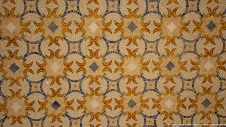 Close view of interlaced floral mosaic.