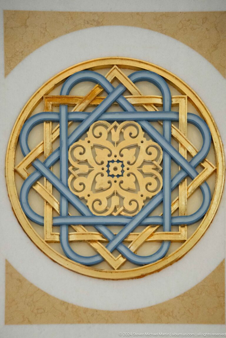 Close blue and gold interlaced geometric motif.