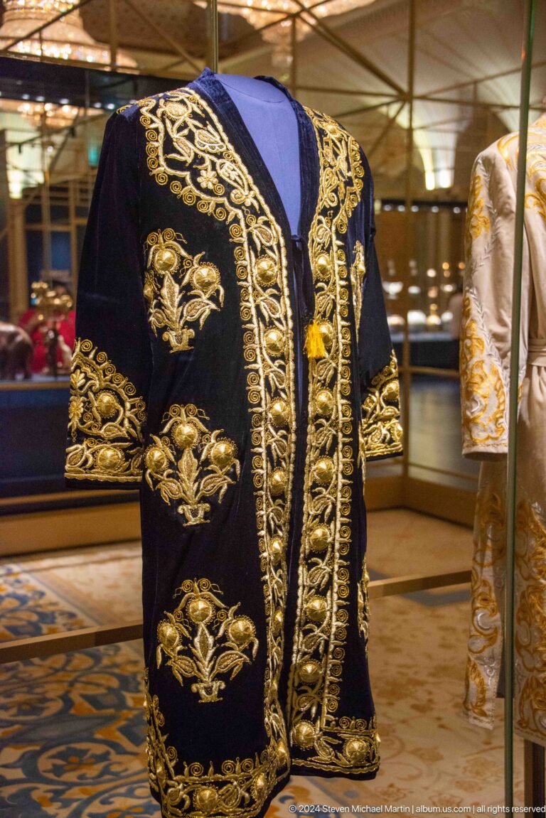 Black ceremonial robe with gold embroidery.