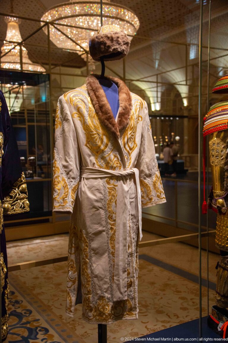 White ceremonial robe with gold trim.
