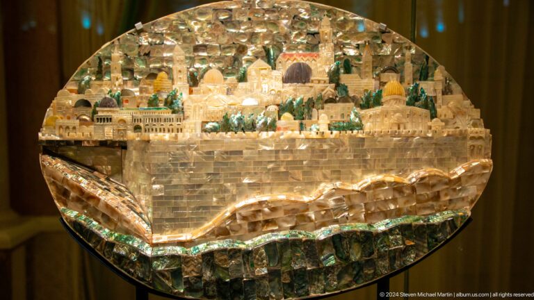 Large stone or crystal model of a city landscape.