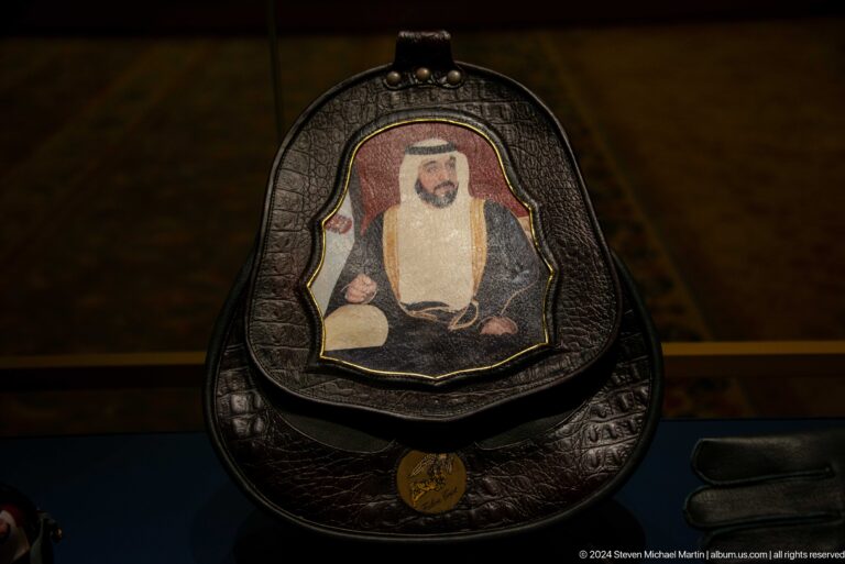 Black embroidered bag or shield-like object.