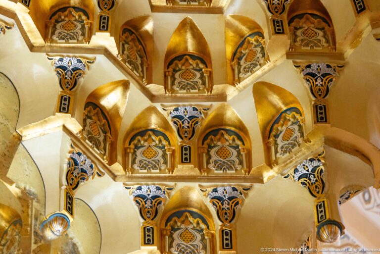 Golden muqarnas or honeycomb vault detail.