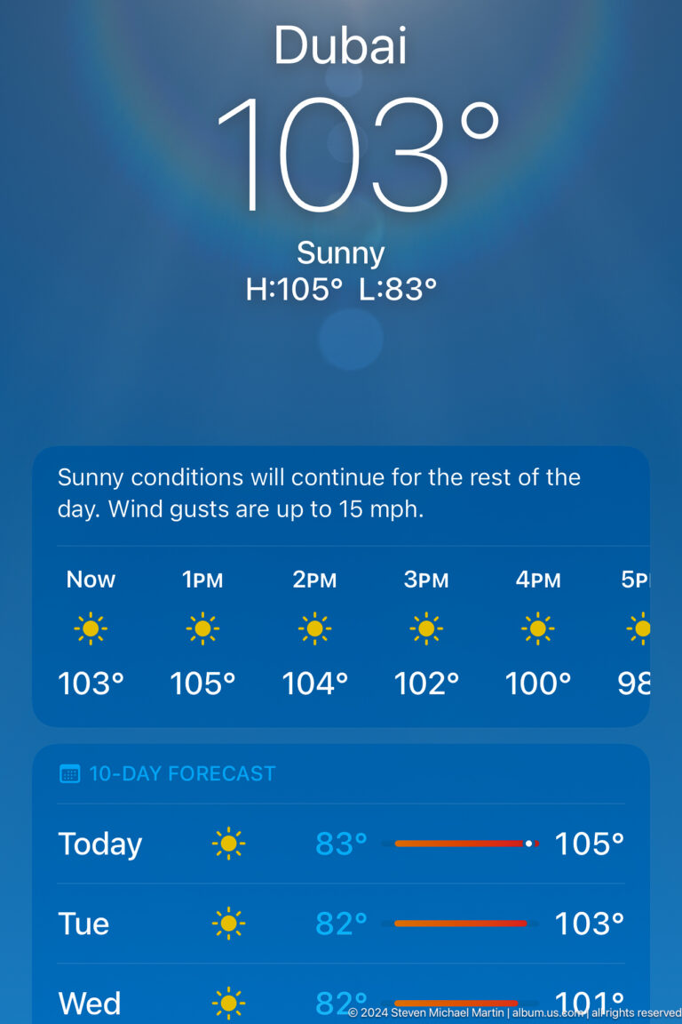 Weather display showing sunny conditions and temperatures above 100 degrees Fahrenheit.