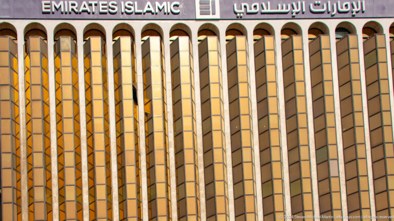 Golden high-rise façade with Dubai Islamic Bank signage.