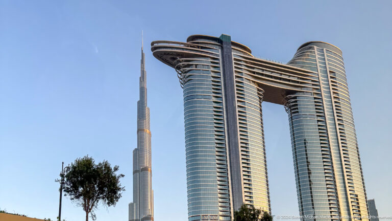 Address Sky View twin towers and skybridge with Burj Khalifa behind.