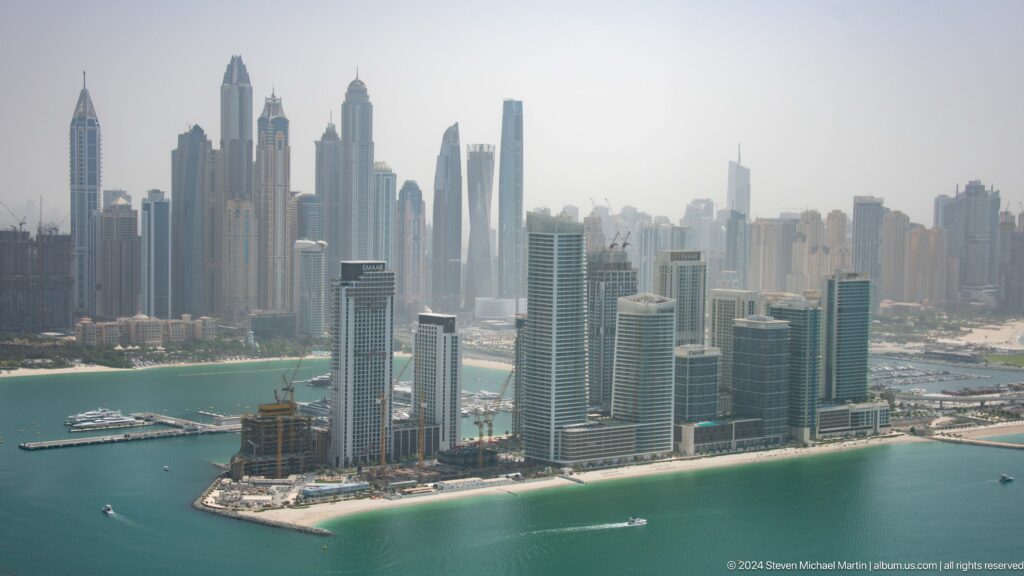 Dubai Marina waterfront towers and dense skyline seen from Palm Jumeirah.