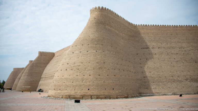 Massive sloping mud-brick wall of Ark fortress.