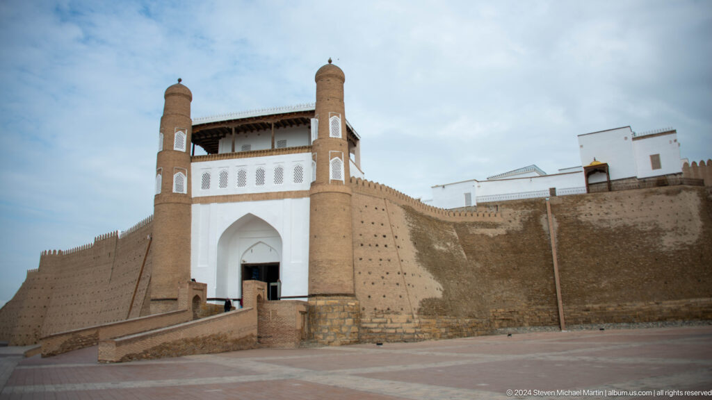 Monumental white gate in Ark fortress walls.