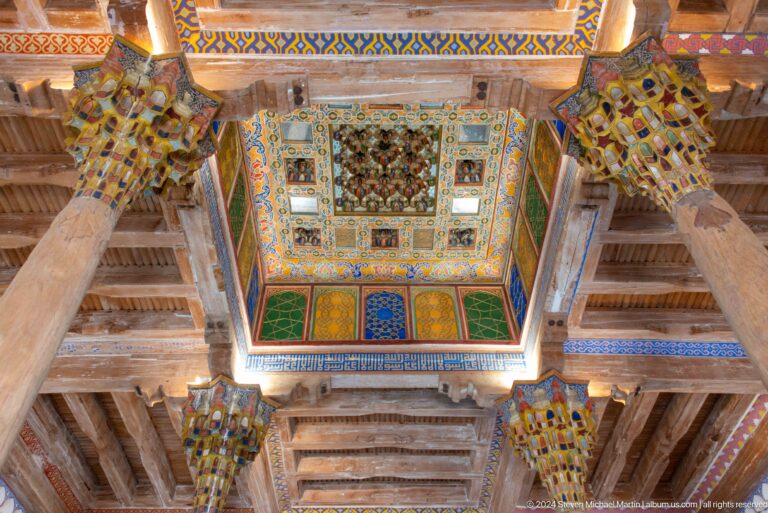 Coffered painted ceiling viewed upward.
