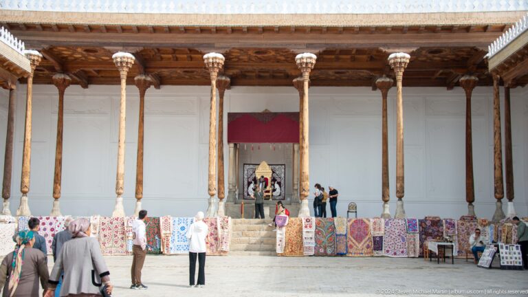 Long wooden veranda with market displays.