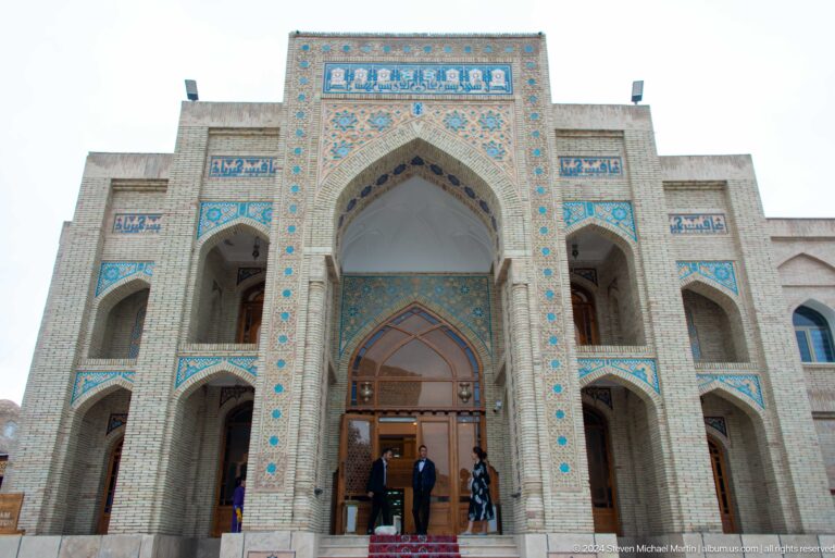Tall tiled entrance portal viewed from below.