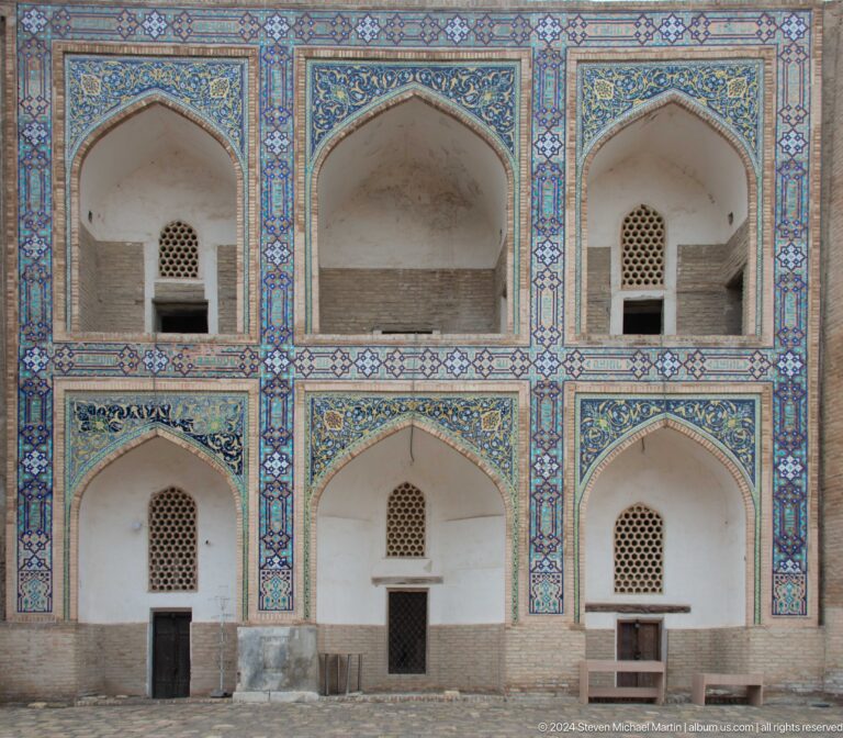 Close view of tiled arched niches.