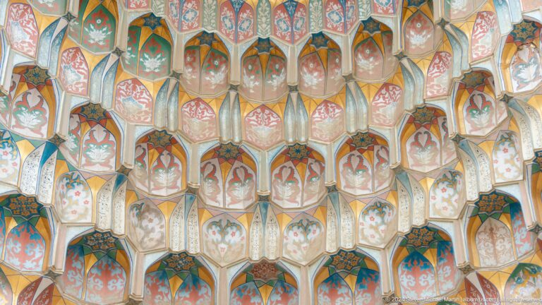 Close-up of multicolored muqarnas cells.