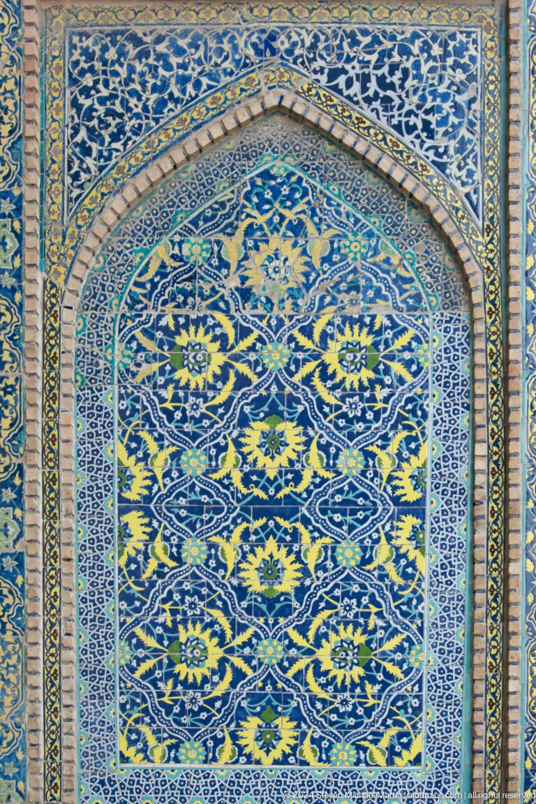 Blue and yellow floral tile panel.