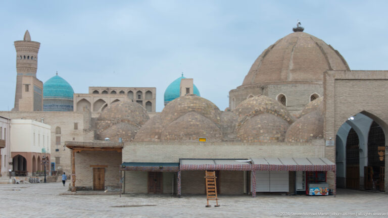 Cluster of low brick domes above market roofs.