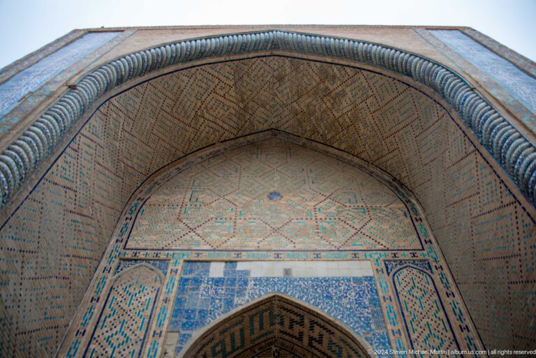 Ornamented tiled arch soffit.