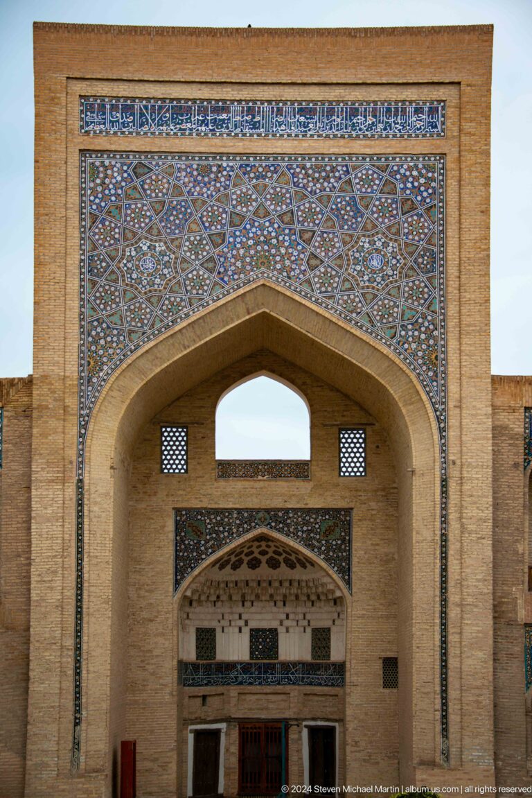 Pointed arch with dense blue mosaic tile.