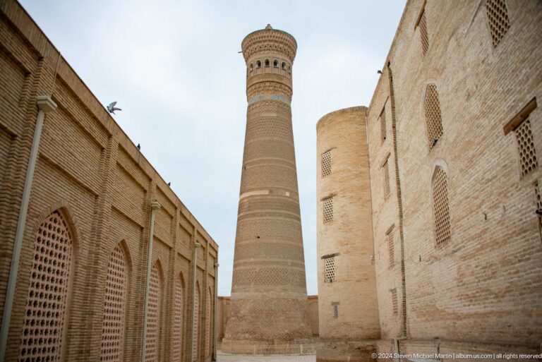 Kalyan Minaret framed by passage walls.