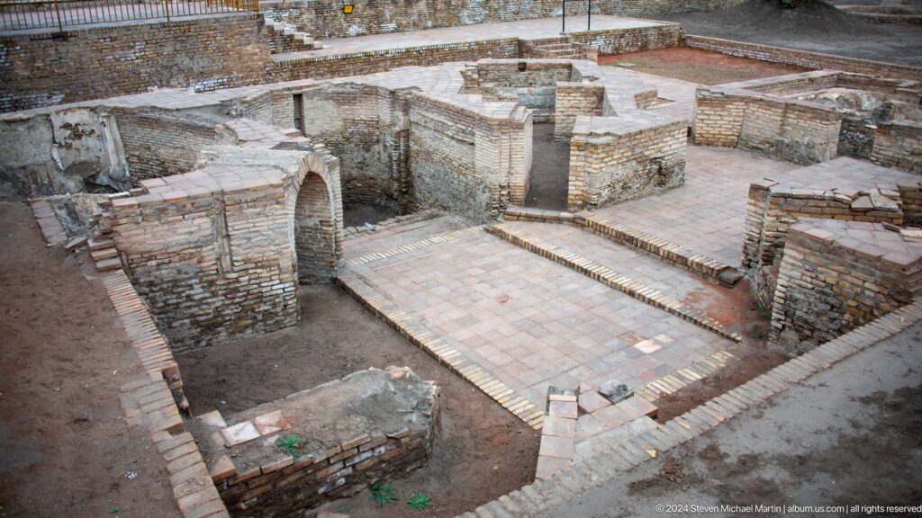 Excavated brick foundations and low walls.